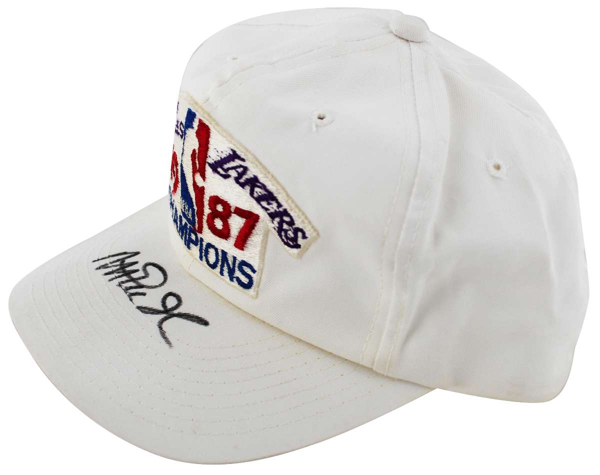 
Lakers Magic Johnson Signed 1987 World Champions White Hat BAS Witness #W426873
